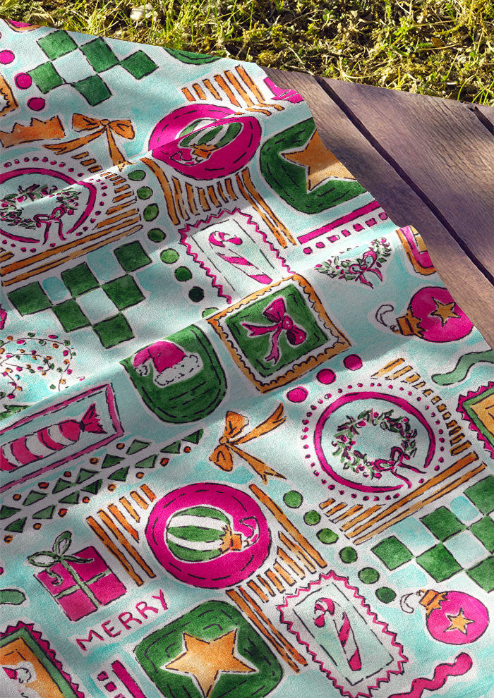 Christmas fabric design with Santa Hats, trees, bows and stars in frames using pastel colours. Australian Surface Pattern Design by Melbourne Artist Laura Hamzic