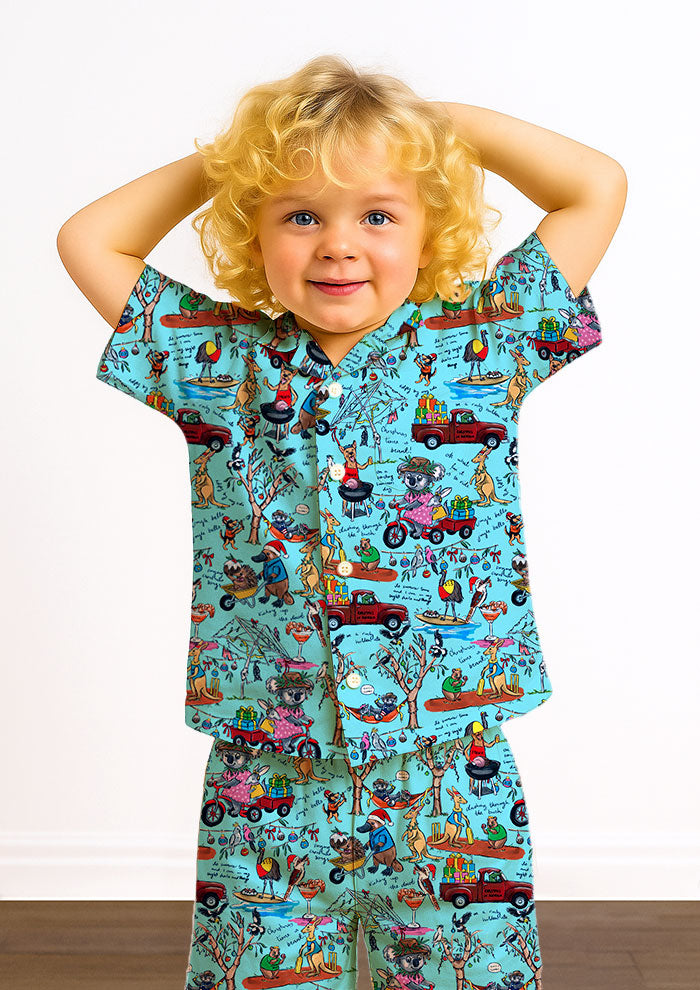 Playful Aussie Christmas kids pj set featuring native animals, BBQs, and backyard cricket. Brisbane Surface Pattern Design by Australian Artist Laura Hamzic