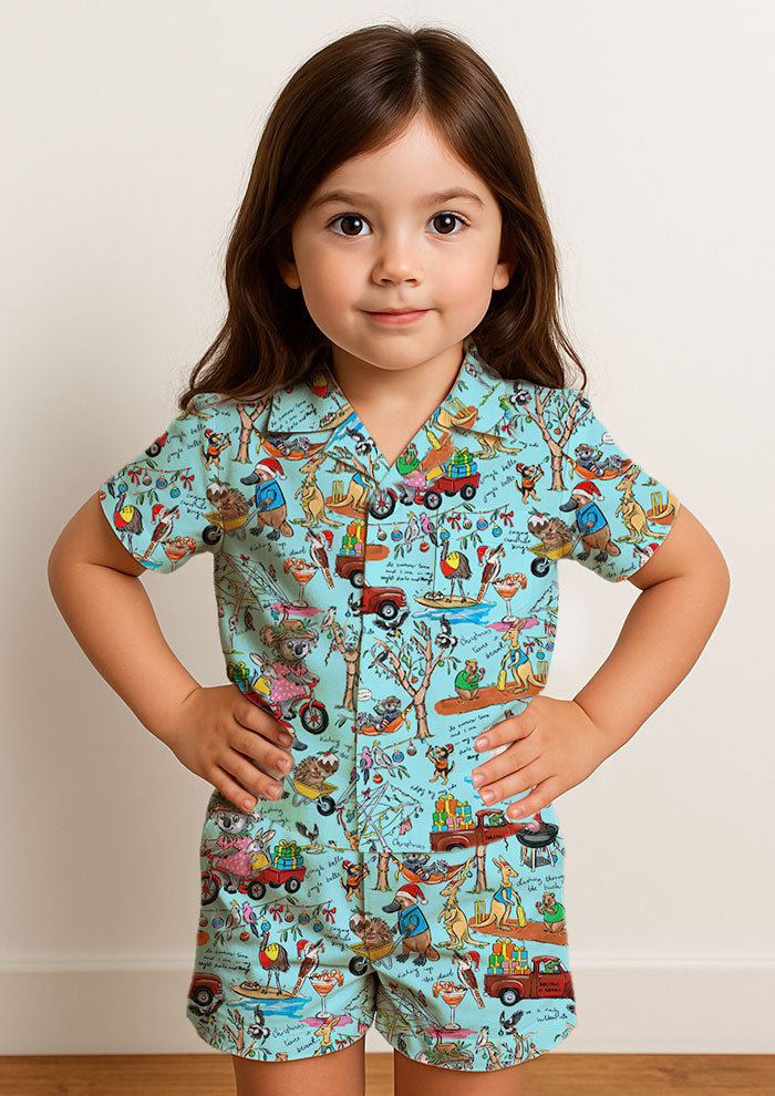Playful Aussie Christmas matching pj set featuring native animals, BBQs, and backyard cricket. Brisbane Surface Pattern Design by Australian Artist Laura Hamzic