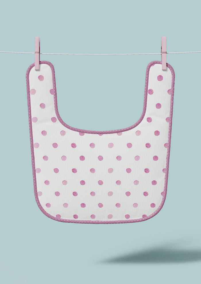 Baby bib mockup showcasing the Confetti Spot (Pink) pattern by Laura Hamzic, Australian surface pattern designer