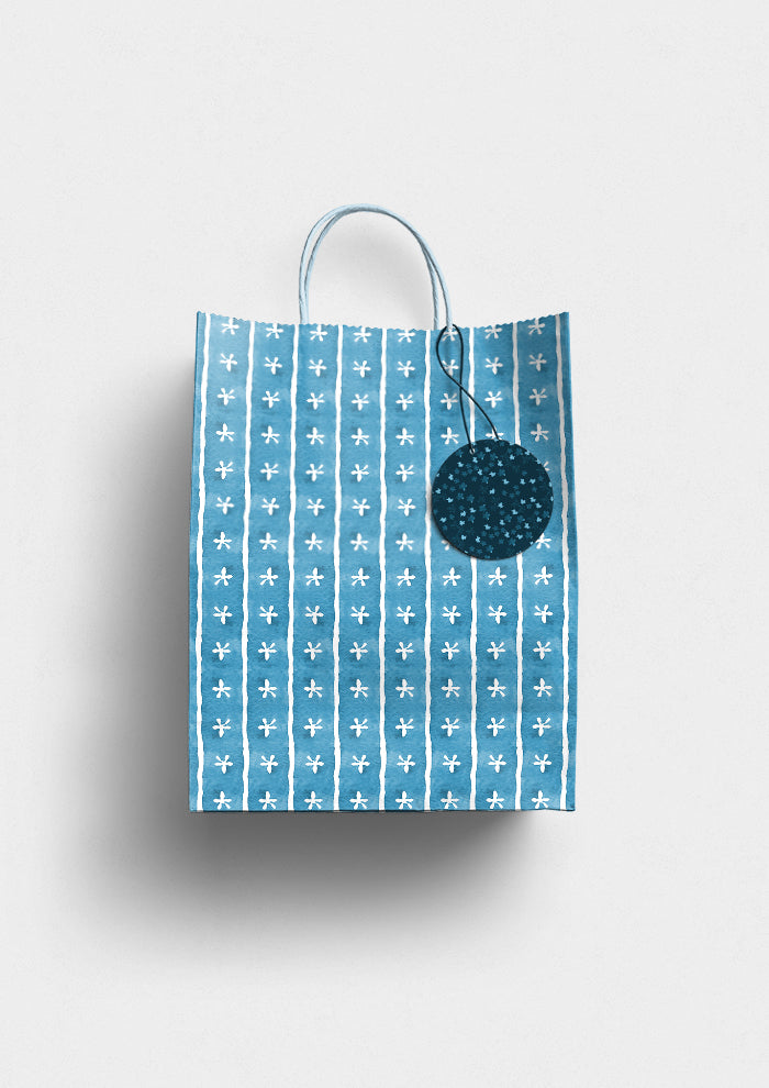 Denim Dancing Daisies pattern on gift bag mockup. Pattern design by Laura Hamzic, Australian Artist.
