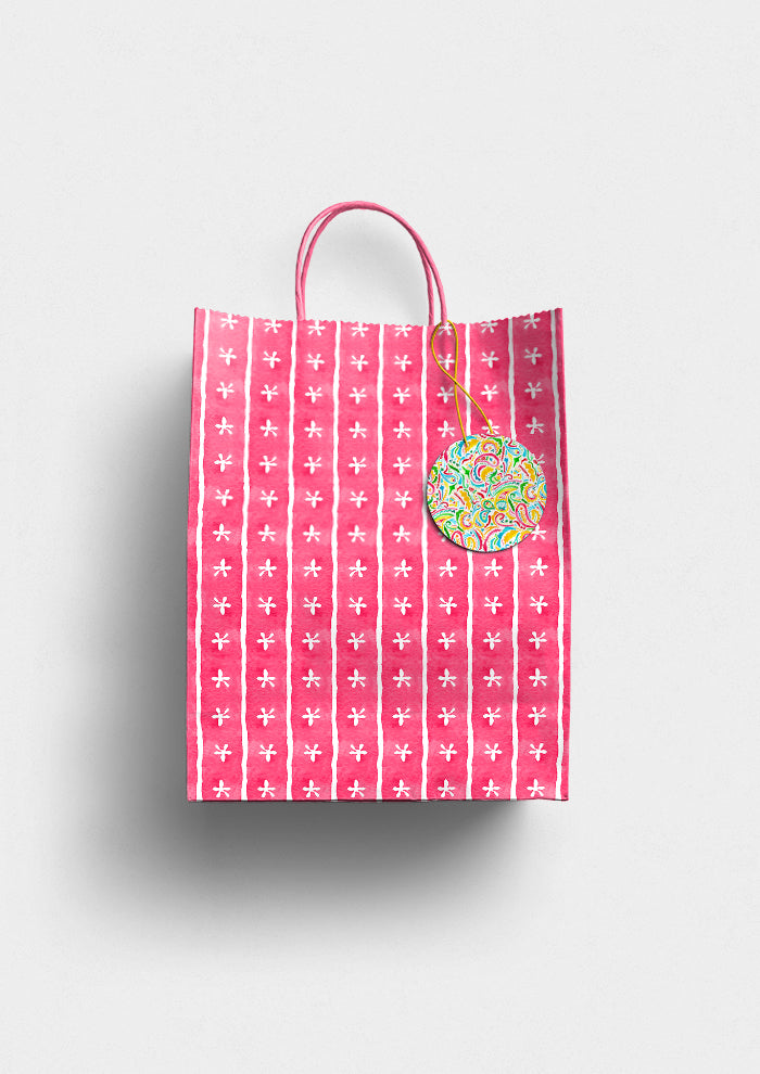 Pink Dancing Daisies pattern on gift bag mockup. Pattern design by Laura Hamzic, Australian Artist.