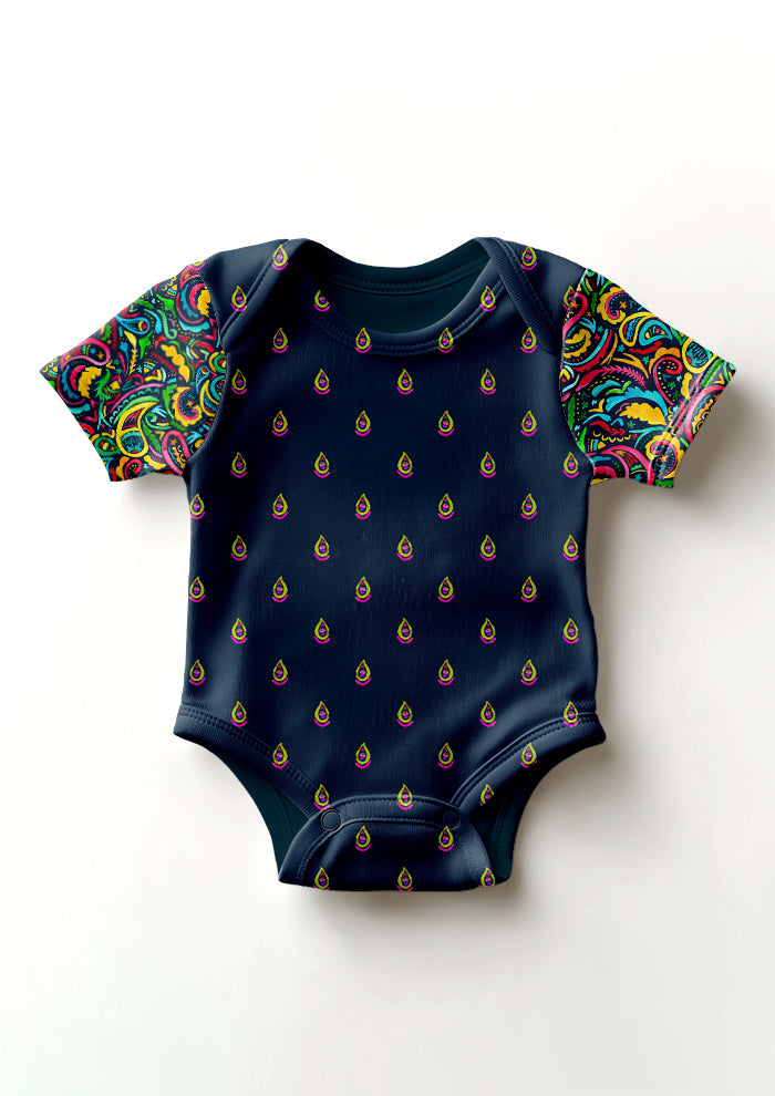 Pink and green Drip Drop pattern on navy, baby onesie mockup with Paisley Days sleeves. Pattern design by Laura Hamzic, Australian Artist.