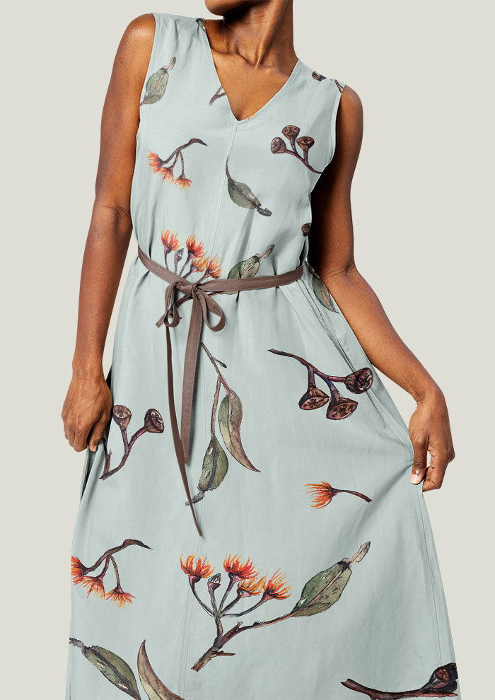 Dress featuring Eucalypt Echo pattern on a mint backgrounf , flowing eucalyptus elements spaced widely for dramatic impact on wallpaper or large fabric prints.