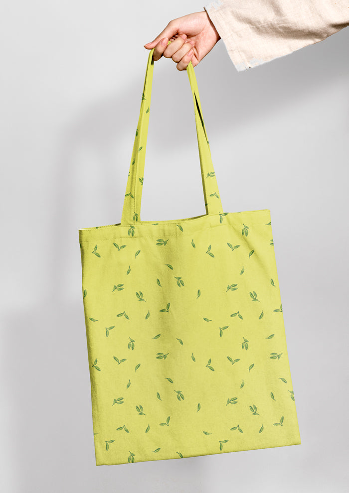 Tote bag mockup featuring the Falling Leaves (Yellow) pattern by Laura Hamzic, Australian surface pattern designer