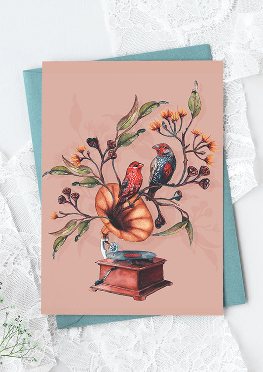 Greeting card featuring the Finch Falsetto placement illustration, red firetail finches perched on a gramophone, with native foliage growing from it in vibrant, true-to-life colours