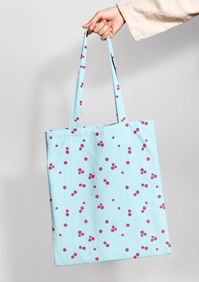 Tote bag mockup featuring the Dotty Bloom (Blue) pattern by Laura Hamzic, Australian surface pattern designer