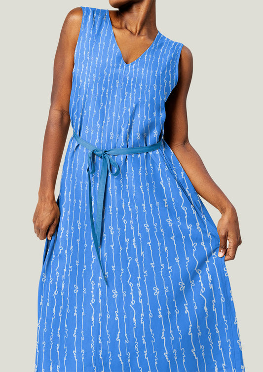 White on Blue Garden Squiggle pattern by Australian surface pattern designer Laura Hamzic mocked up on a dress