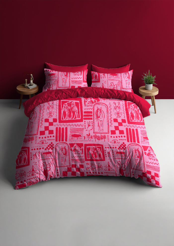 Red and white patterned bedding set on a bed against a red wall.