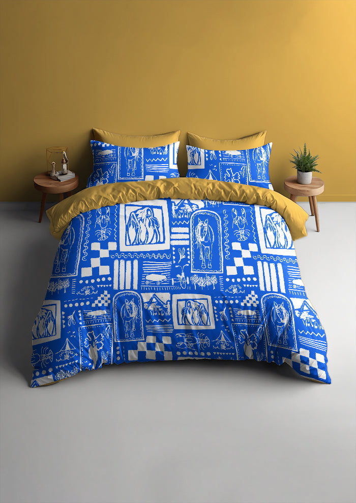 Blue and white patterned bedding set on a bed with yellow pillows against a yellow wall.