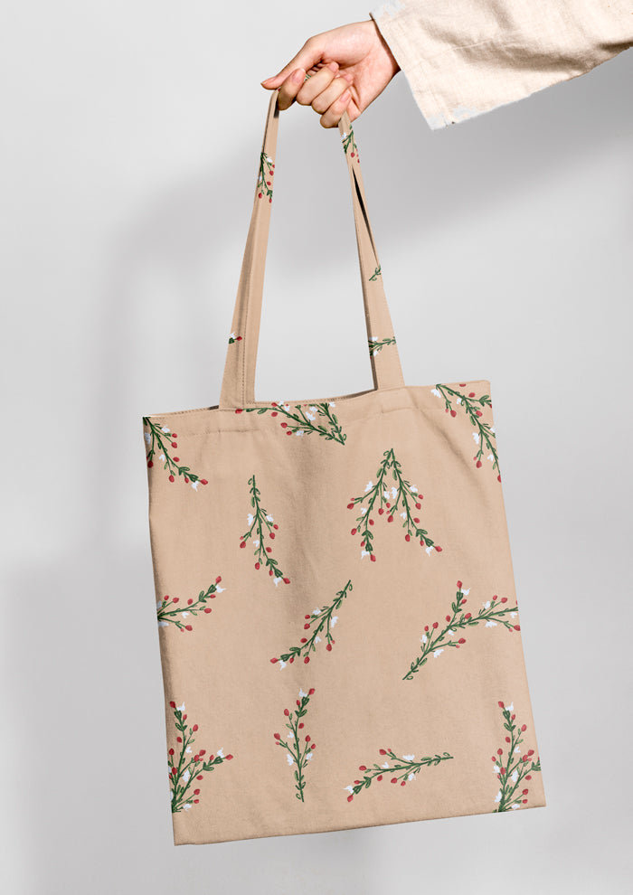 Tote bag mockup showcasing the Mock Orange Berries (Beige) pattern by Laura Hamzic, Australian surface pattern designer
