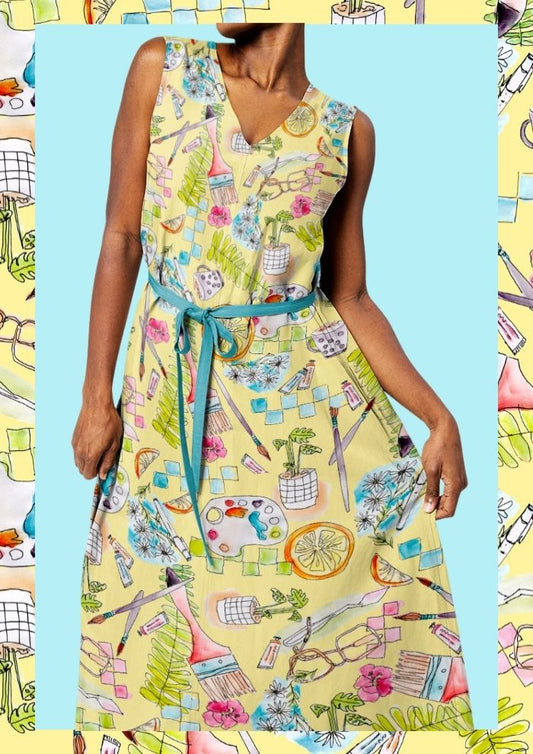 Women’s dress featuring the Painter’s Playground pattern with playful hand-painted artist studio illustrations