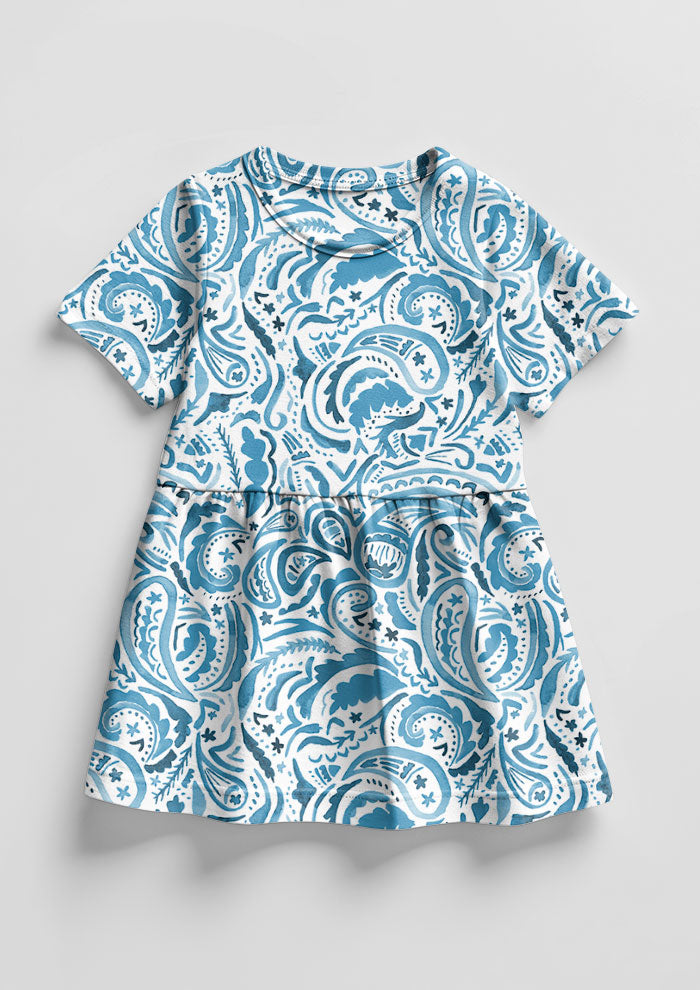Denim Paisley Blues pattern on little girl's dress mockup. Pattern design by Laura Hamzic, Australian Artist.