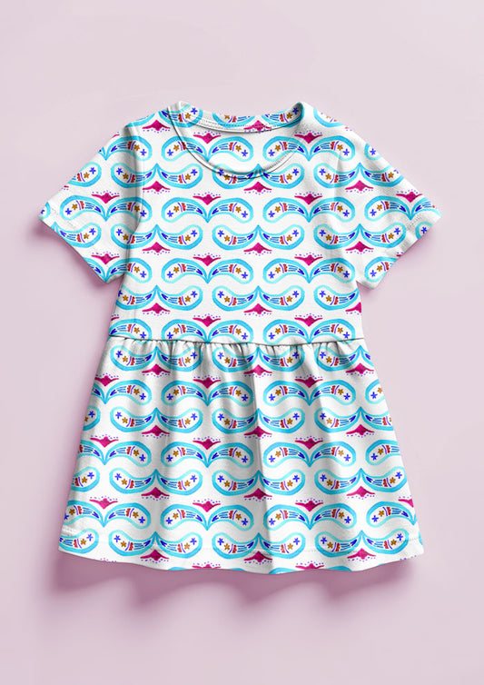 Pink and blue Paisley Whirl pattern on little girl's dress mockup. Pattern design by Laura Hamzic, Australian Artist.