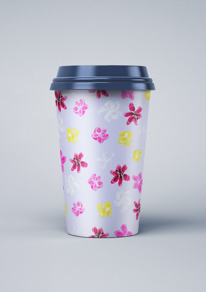 Laura Hamzic Australian artist's Petal Parade mocked up on a coffee cup - fun florals scatter across a soft blue background