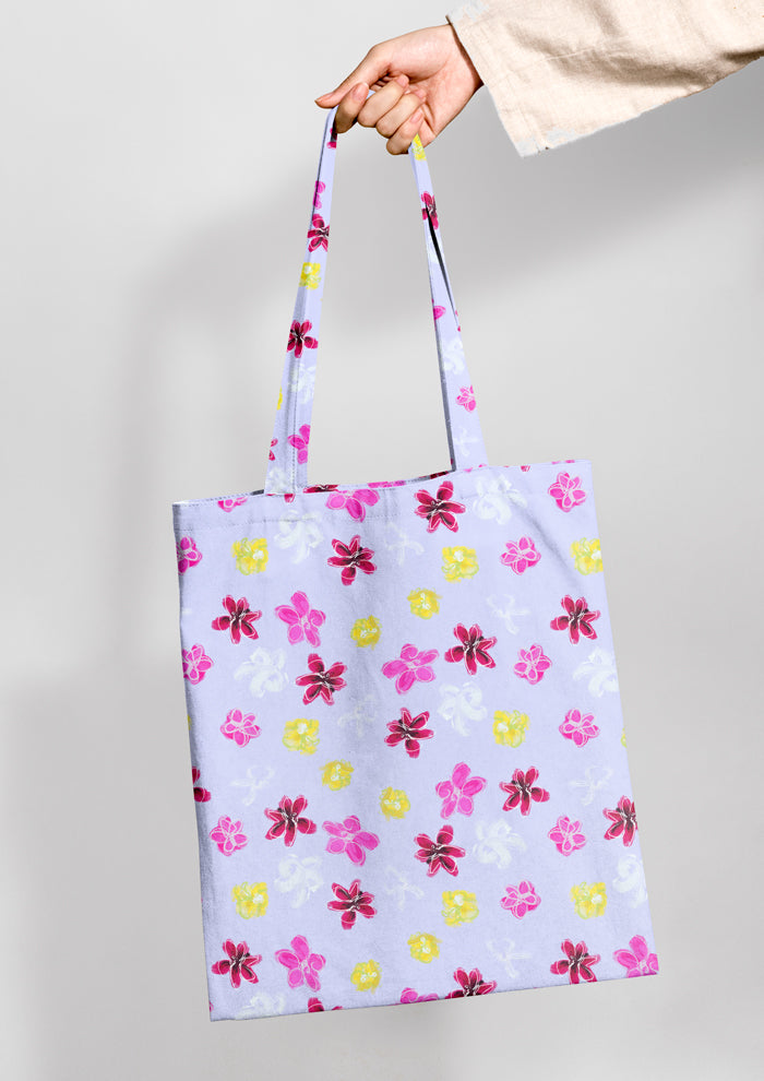 Laura Hamzic Australian artist's Petal Parade mocked up on a shopping bag - fun florals scatter across a soft blue background