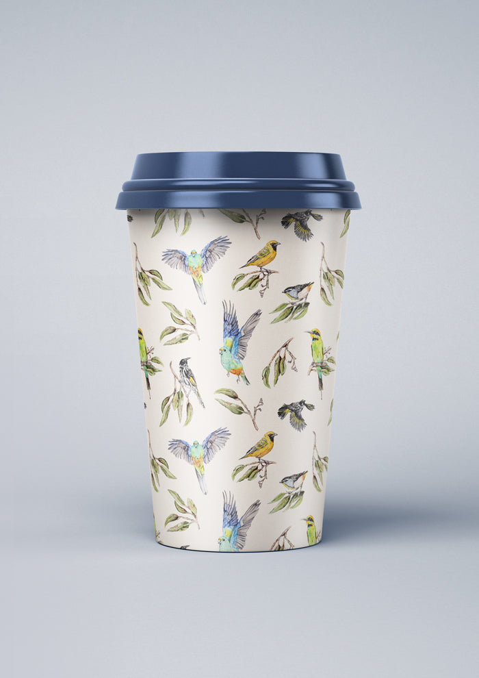 Coffee cup featuring Sunday Social Club surface pattern by Laura Hamzic, balanced spacing of native birds and foliage for versatile product use.