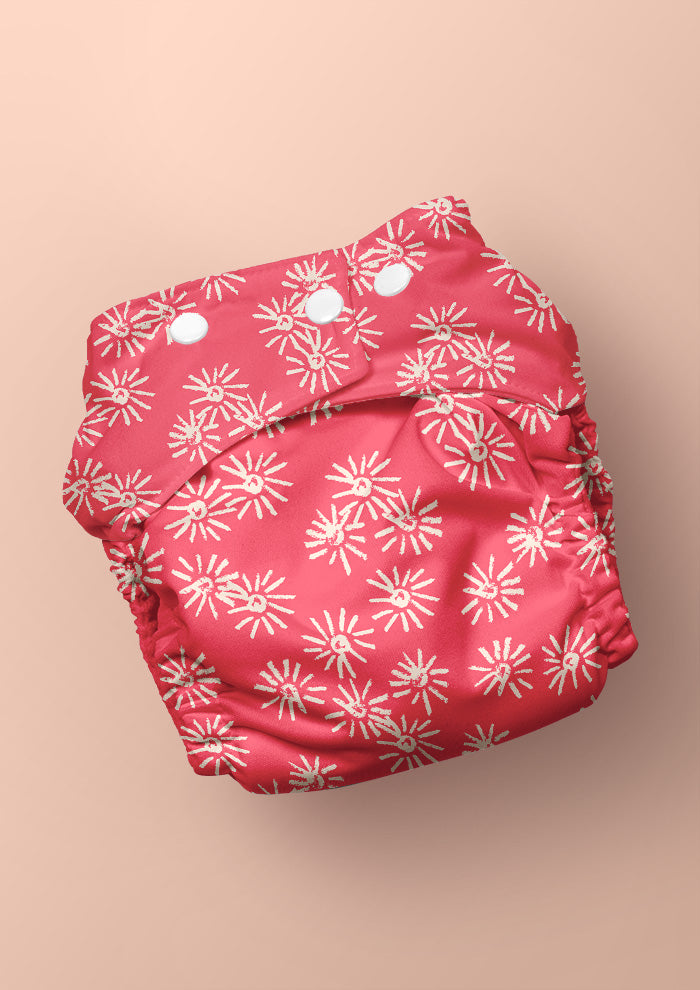 Baby nappy with Flicker Flower eucalyptus blossom surface pattern – playful coloured pencil flowers, joyful Australian botanical kidswear fabric design.