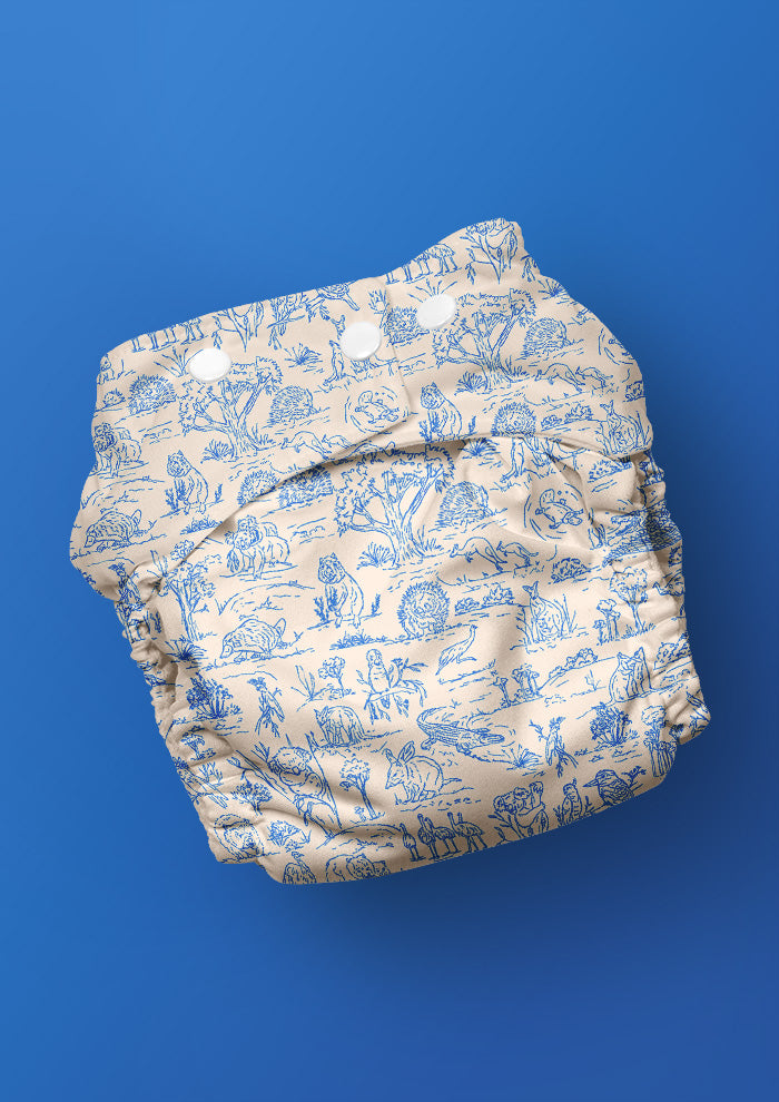 Baby nappy with Australian animal surface pattern – fine liner ink drawings of wombats, kangaroos, emus, and bush wildlife. Playful Australiana kidswear and baby fabric design.