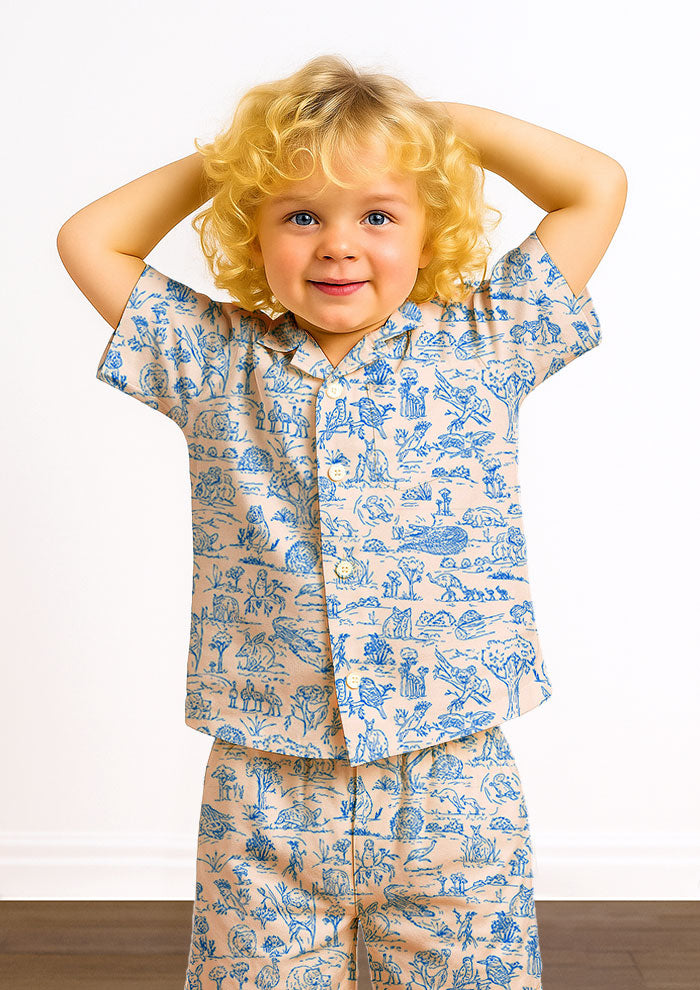 Kids pyjamas with Australian animal surface pattern – fine liner drawings of wombats, kangaroos, emus, and bush creatures in a fun, storybook-style Australiana design.