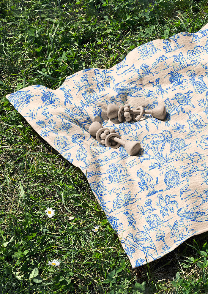 Swaddle featuring Australian animal pattern – finely sketched wombats, kangaroos, emus, and bush creatures. Storybook-style Australiana surface pattern design for apparel and homewares.