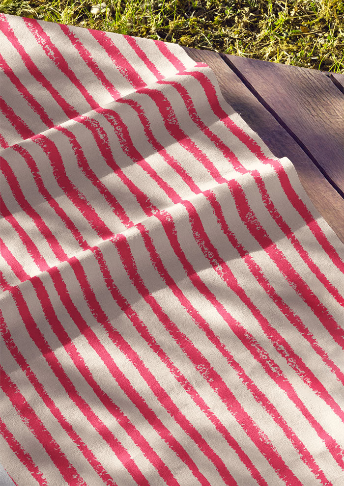 Cotton fabric featuring Sandy Stripe wobbly stripe pattern – lively organic hand-drawn lines inspired by kids playing in the sand, versatile Australian fabric for apparel and kidswear.