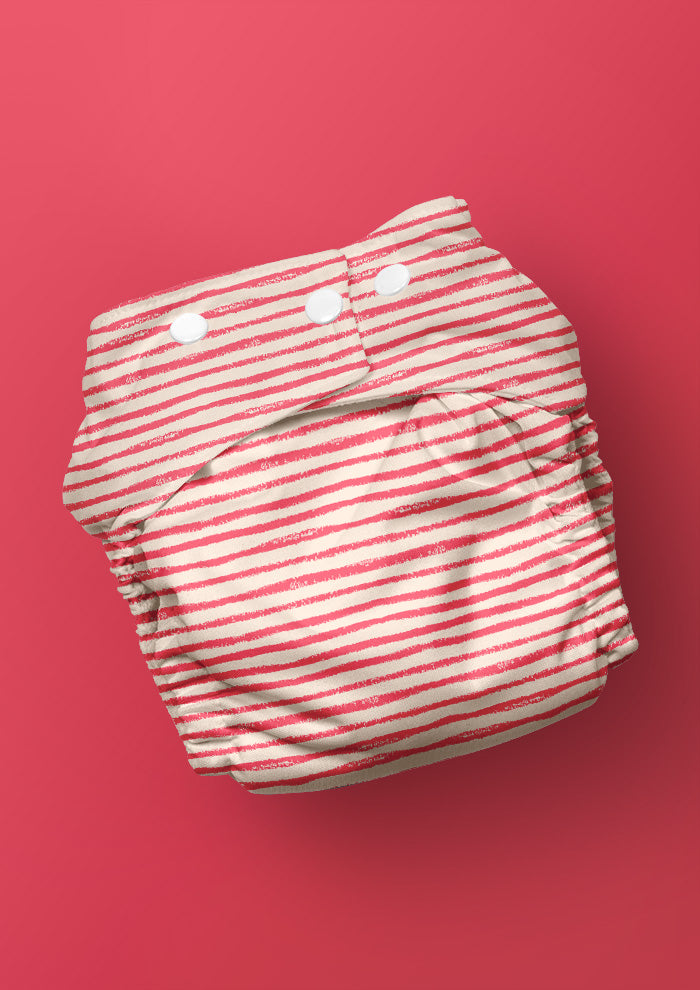 Baby nappy with Sandy Stripe hand-drawn stripe surface pattern – sketchy wobbly lines inspired by kids’ sandy trails, playful Australian kidswear fabric design.