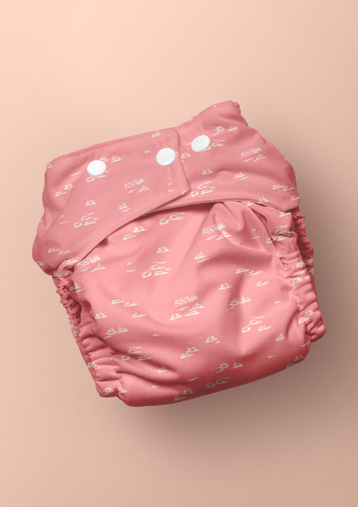 Baby nappy with Spinifex Scatter surface pattern – hand-drawn scraggly spinifex grasses in a playful, natural layout, Australian kidswear and baby fabric design.