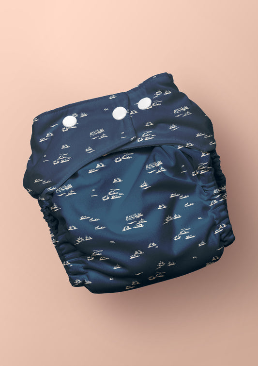 Baby nappy with Spinifex Scatter surface pattern – hand-drawn scraggly spinifex grasses in a playful, natural layout, Australian kidswear and baby fabric design.