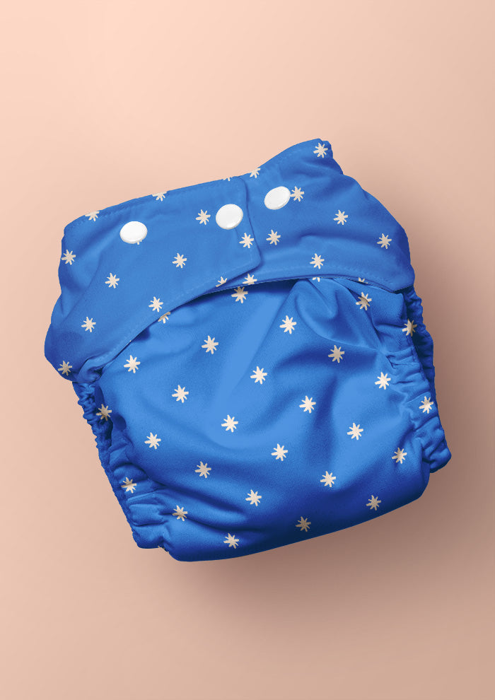 Baby nappy with Star Bright whimsical pencil-drawn stars – inspired by night skies on camping trips, playful Australian kidswear, baby clothing fabric, children’s surface pattern design.