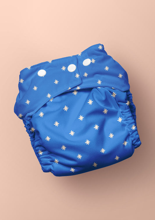 Baby nappy with Star Bright whimsical pencil-drawn stars – inspired by night skies on camping trips, playful Australian kidswear, baby clothing fabric, children’s surface pattern design.