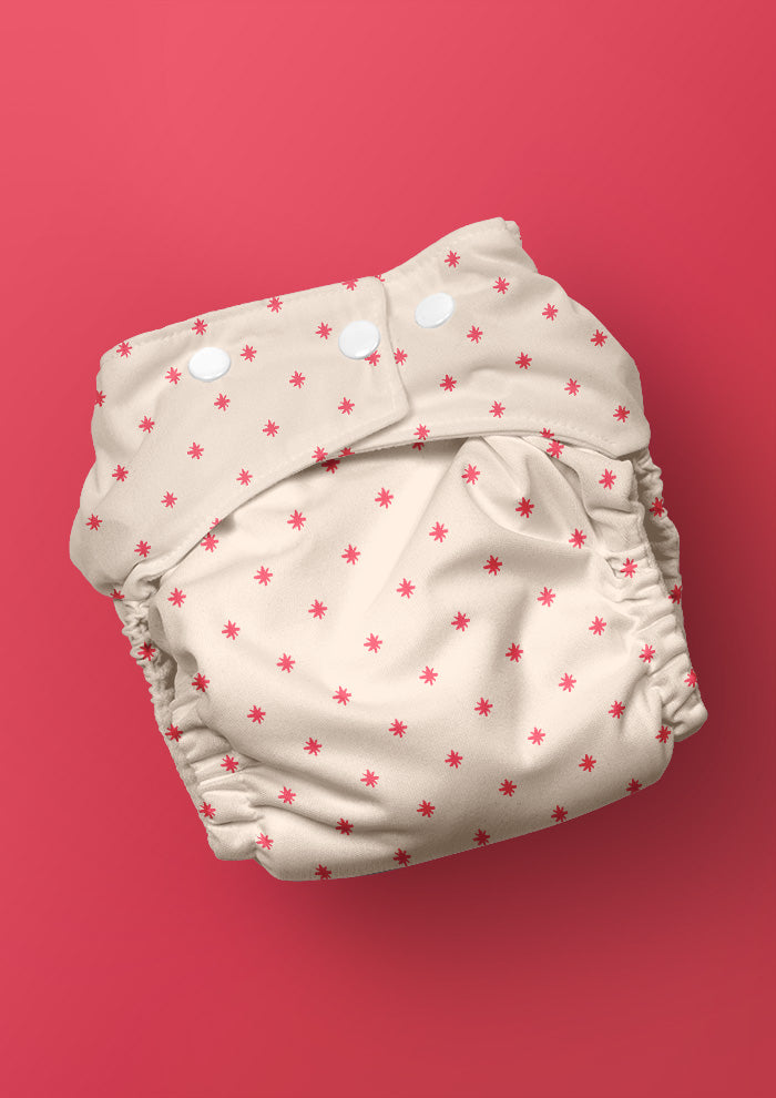 Baby nappy with Star Bright whimsical pencil-drawn stars – inspired by night skies on camping trips, playful Australian kidswear, baby clothing fabric, children’s surface pattern design.