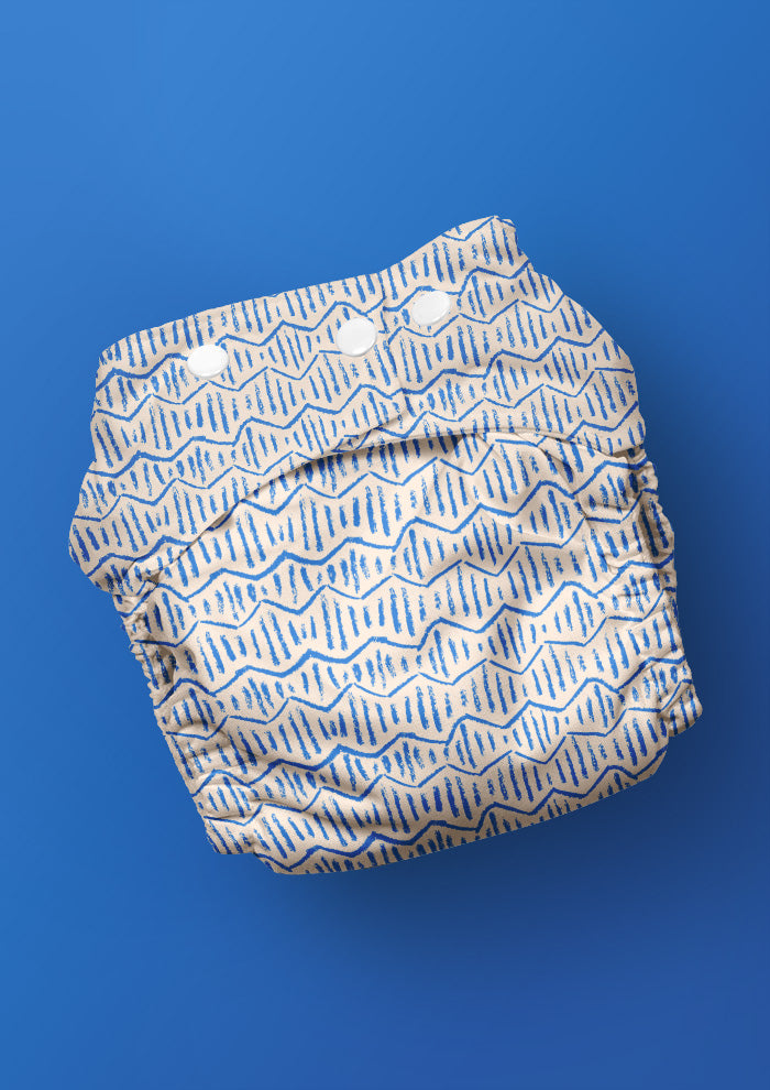 Baby nappy with Zig Zag Track energetic zig-zag surface pattern – coloured pencil texture, inspired by winding bushwalks and childhood discovery, playful Australian kidswear fabric design.