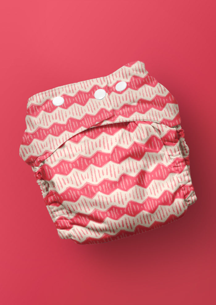 Baby nappy with Zig Zag Track energetic zig-zag surface pattern – coloured pencil texture, inspired by winding bushwalks and childhood discovery, playful Australian kidswear fabric design.