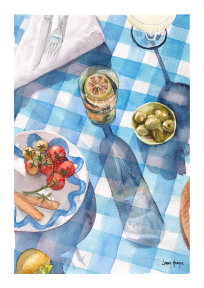 Watercolour art print of a blue and white gingham table setting, greek theme with tomatos, olives and champagne in the sunlight, hand-painted by Laura Hamzic.