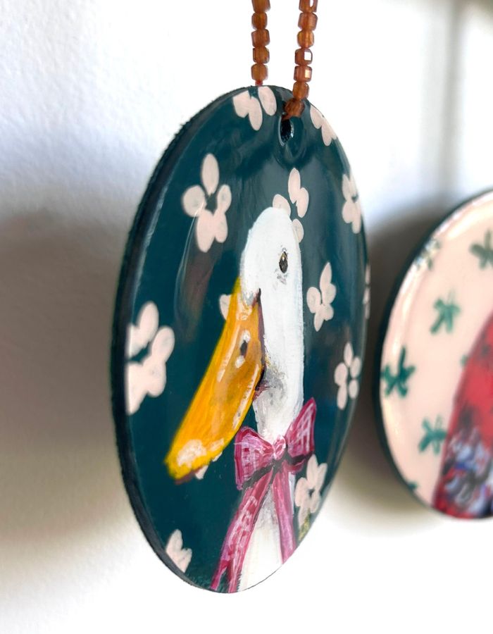 Close-up of Just Ducky ornament showing glossy resin finish and handmade beaded hanger