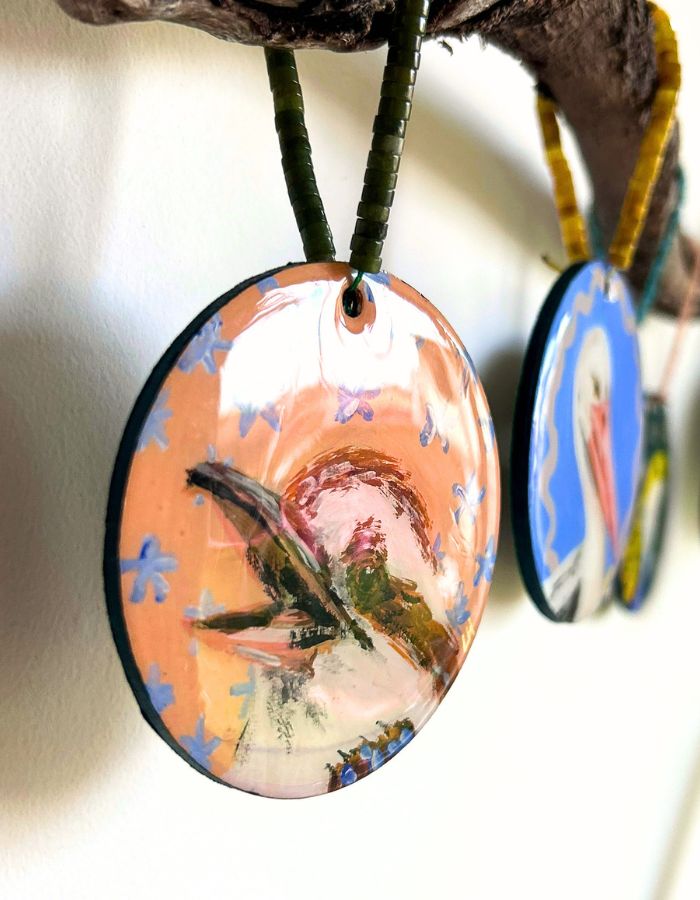 Close-up of Chuckles kookaburra ornament showing glossy resin finish and handmade beaded hanger