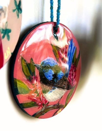 Detail of Tiny Dancer fairy-wren ornament showing glossy resin finish and handmade beaded hanger