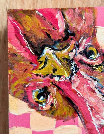 Original chicken painting on pink and cream checkerboard background