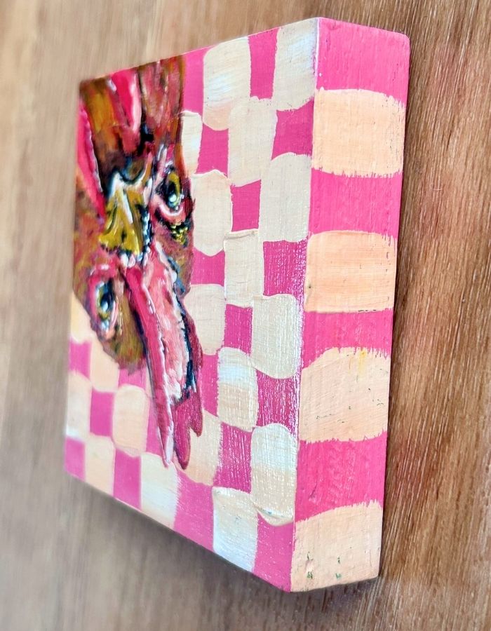 Pink and cream patterned sides of chicken timber panel