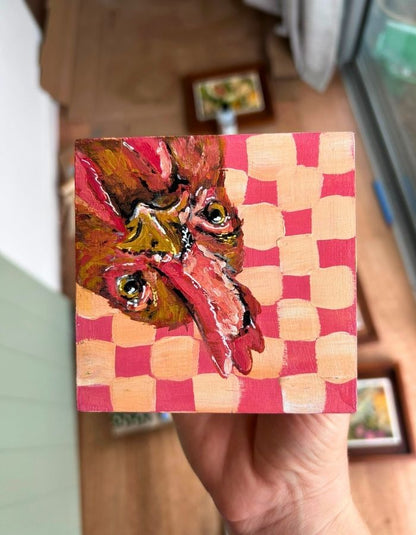 Cheepy original 10 × 10 cm painting held in hand for scale