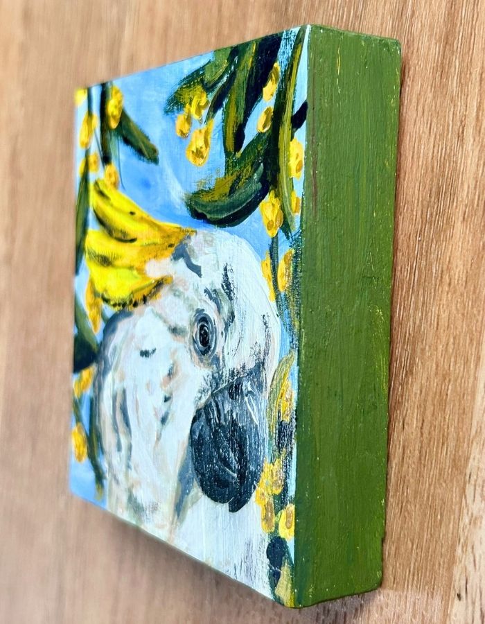 Painted dark green edges of cockatoo timber panel