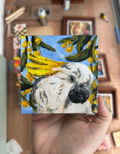 Hello Cocky original 10 × 10 cm artwork held in hand