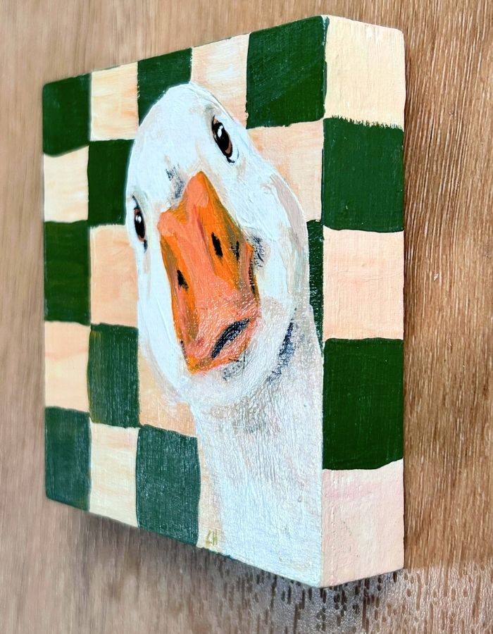 Hand-painted green and cream edges of duck timber artwork
