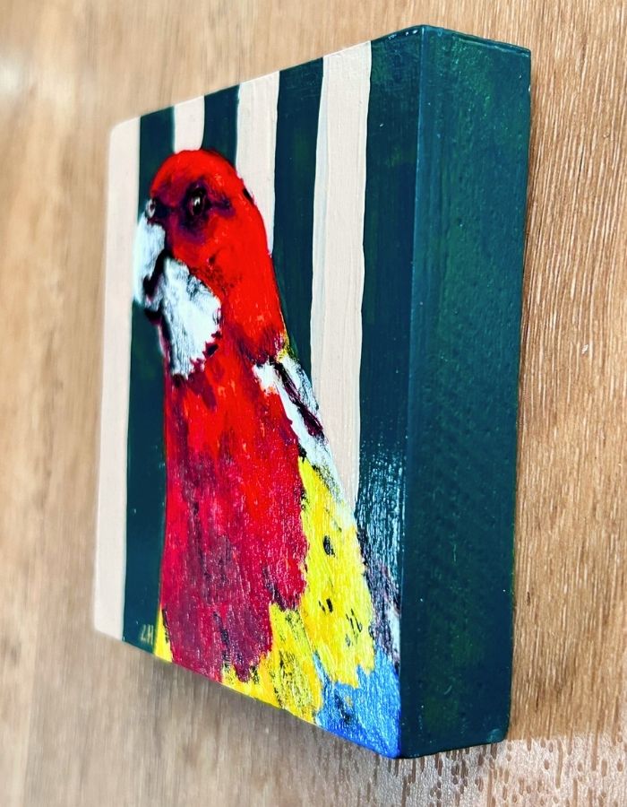 Textured acrylic detail on colourful Australian rosella painting