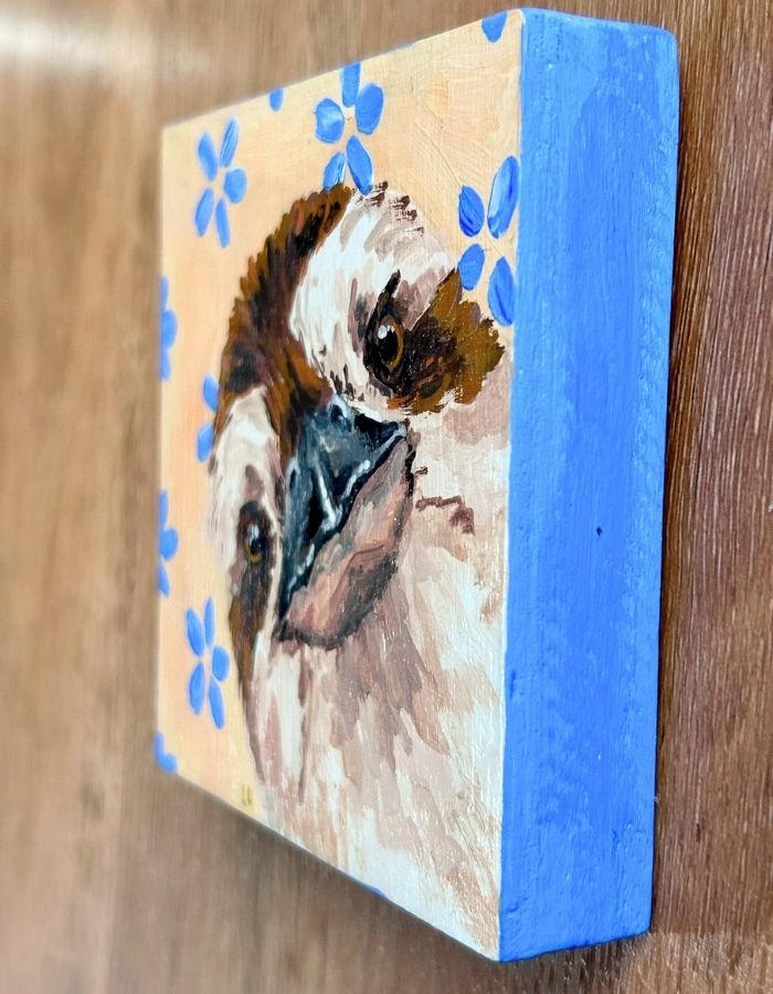 Hand-painted edges of 10 × 10 cm kookaburra timber panel