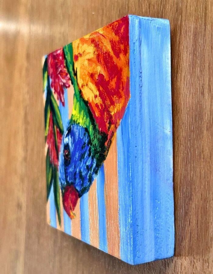 Textured acrylic brushstrokes on colourful lorikeet artwork