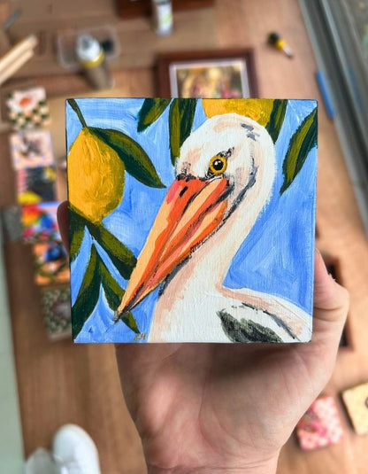 Peli-can original 10 × 10 cm painting held in hand