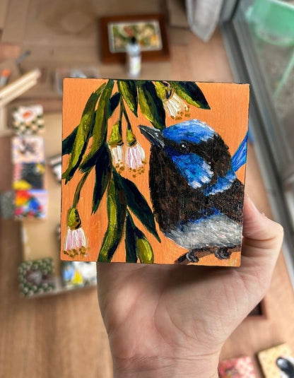 Little Blue original 10 × 10 cm painting held in hand