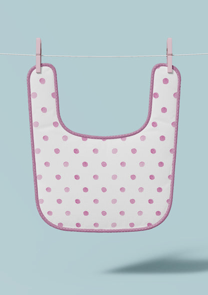 Baby bib mockup showcasing the Confetti Spot (Pink) pattern by Laura Hamzic, Australian surface pattern designer